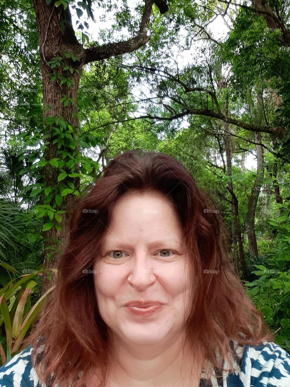 I love to go to parks to walk around, be in nature, and take pictures. I also love to take silly photos while making silly faces. I took this selfie at Mead Botanical Garden in Winter Park, Florida.