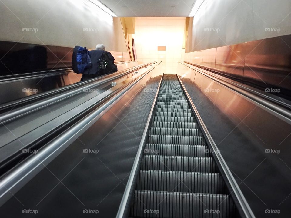 Traveler on an escalator