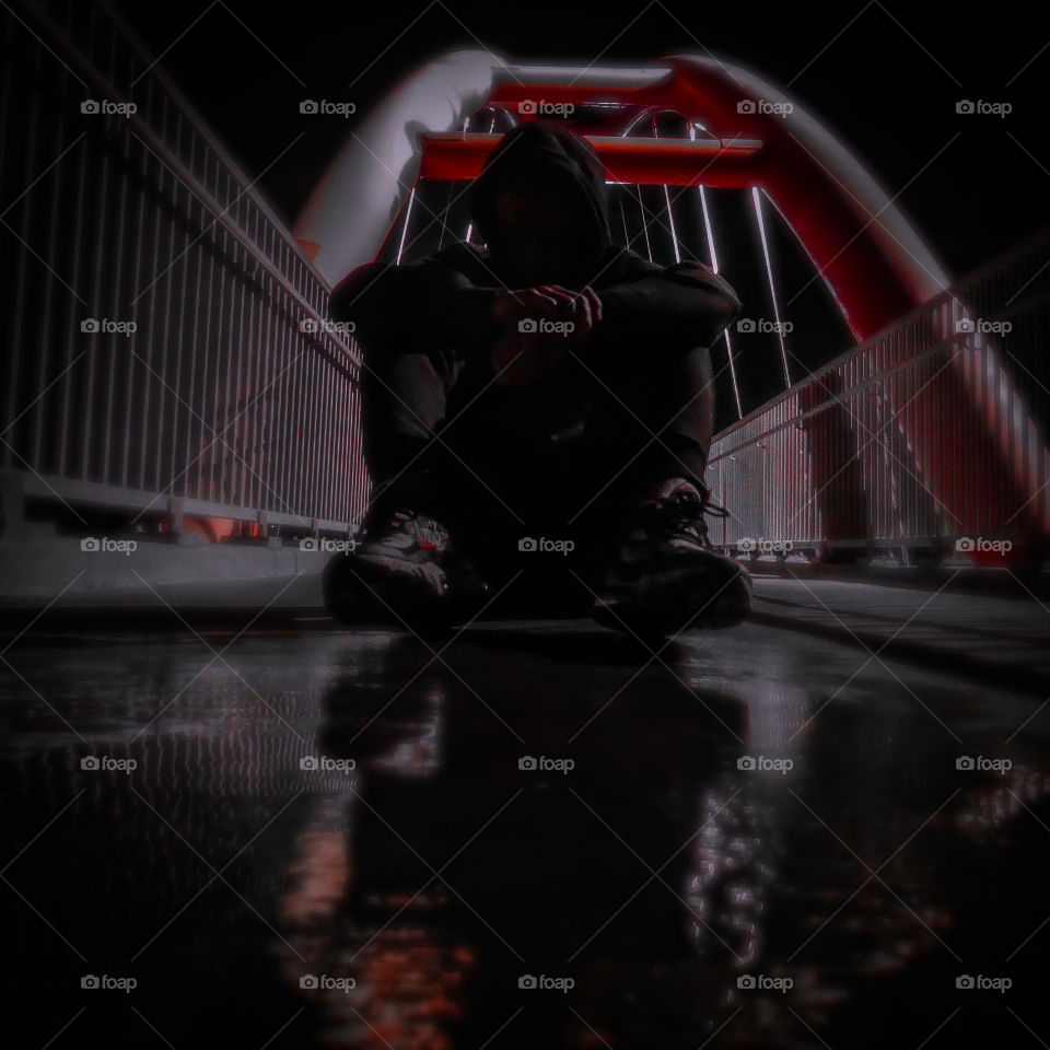 Self-portrait under the bow trail bridge in Calgary AB after a rainstorm. Shot on Lumix camera.