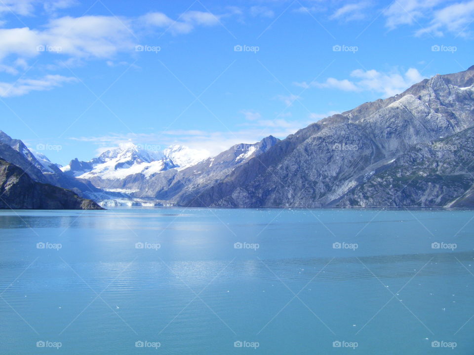Calm Ocean waters, window view while cruising past glaciers and mountains in Alaska