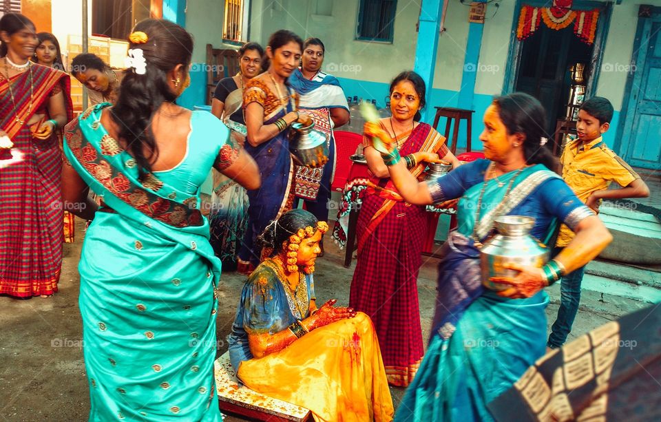 Women celebrating haldi ceremony