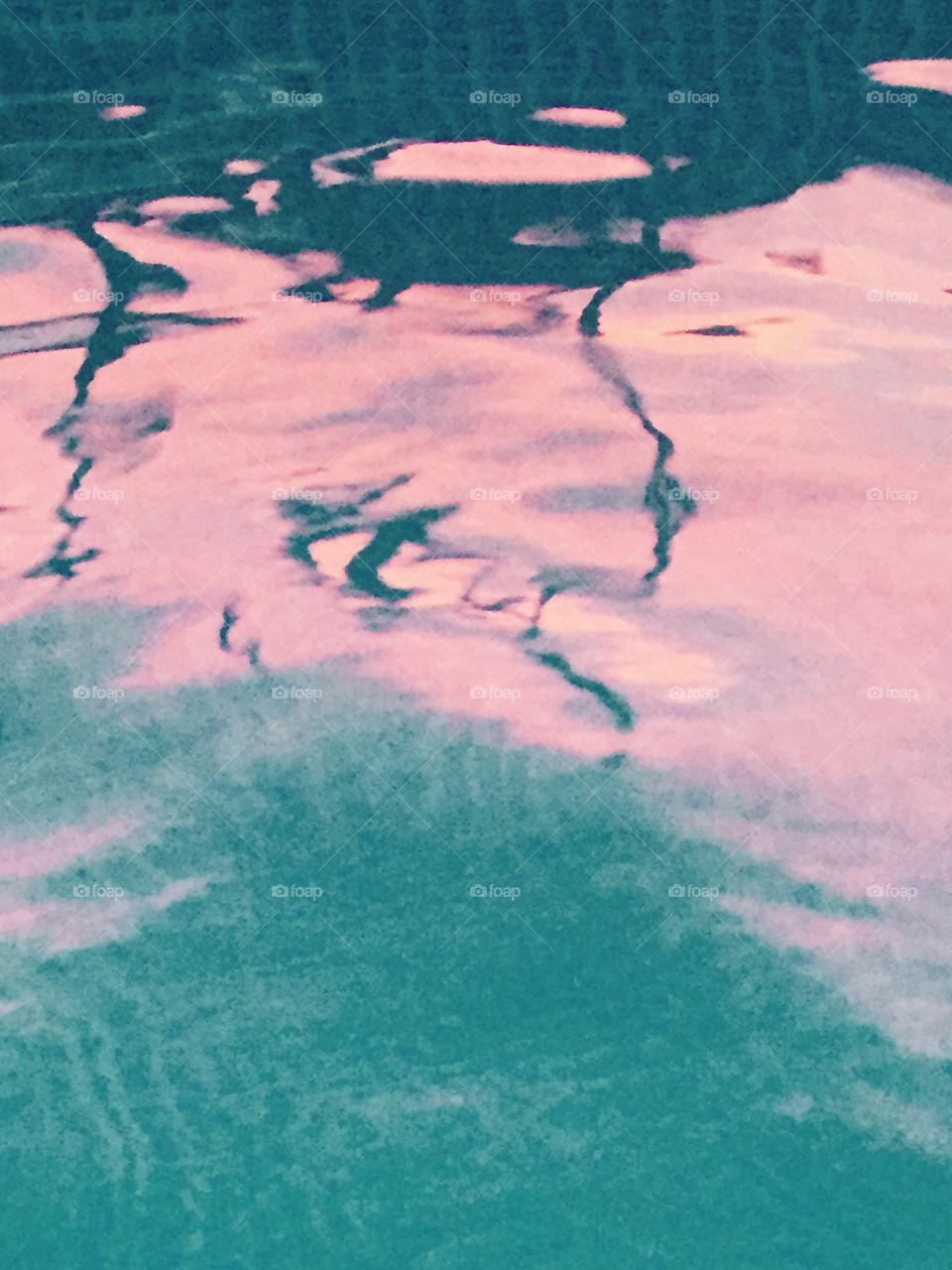 August summer sunset reflecting in our pool water making it a pink glowing pool water!