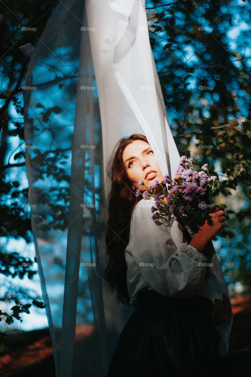 holding autumn flowers