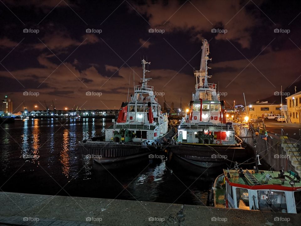 Tug boats in night light