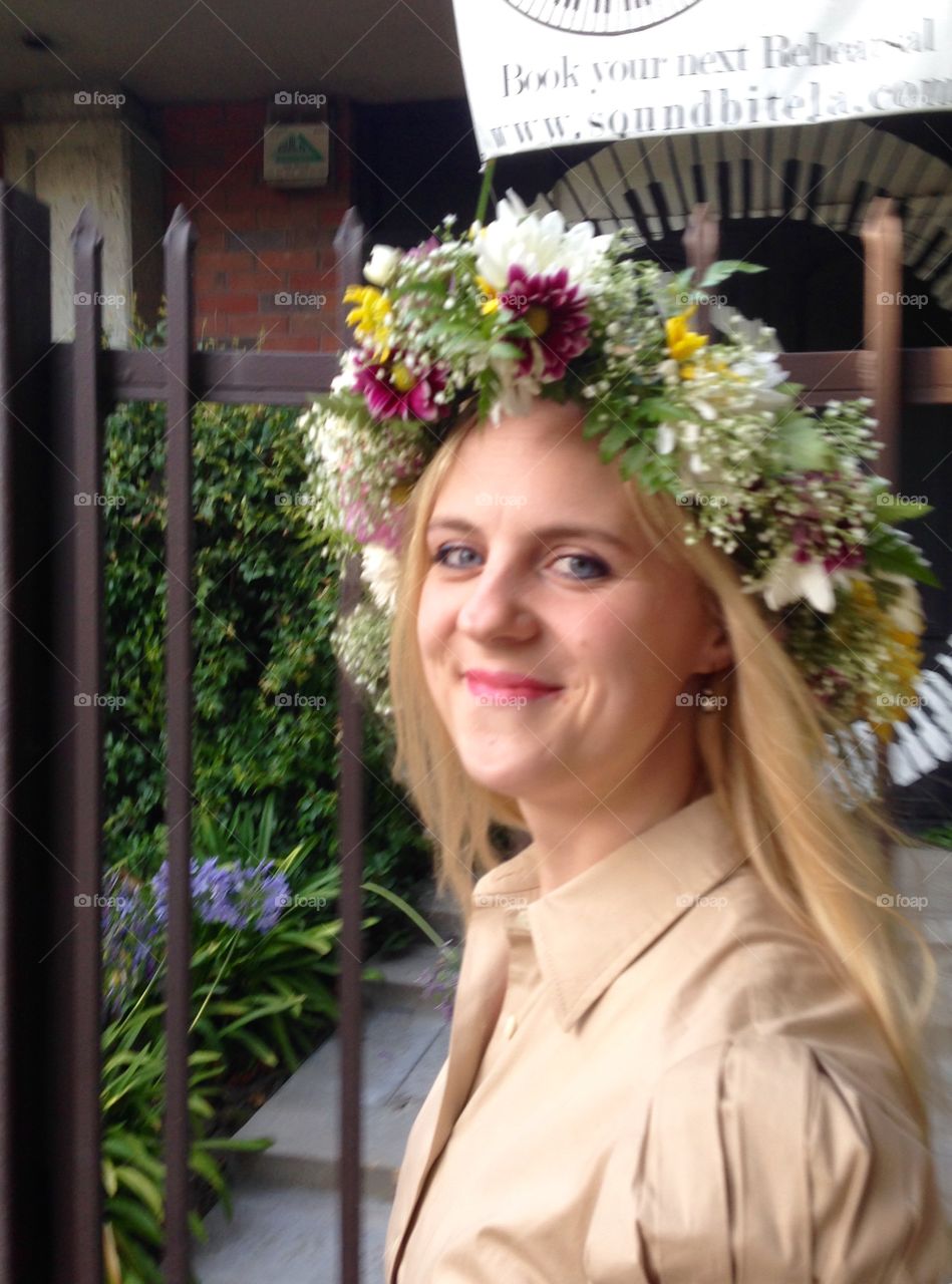 Beautiful woman wearing wreath on head