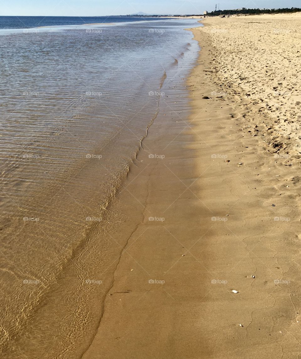 Walk between sea and sand 