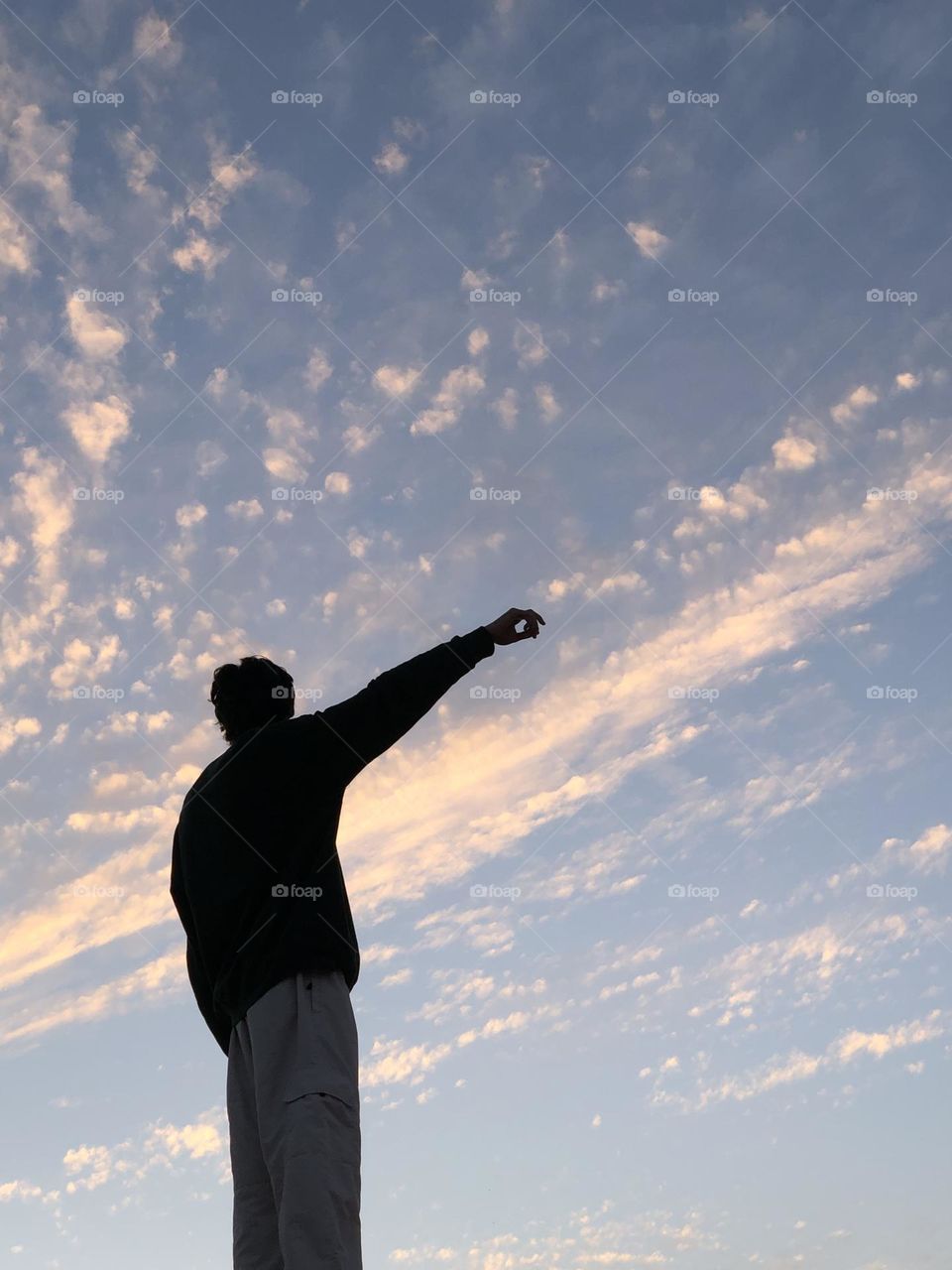 an adult man looking at the sky 