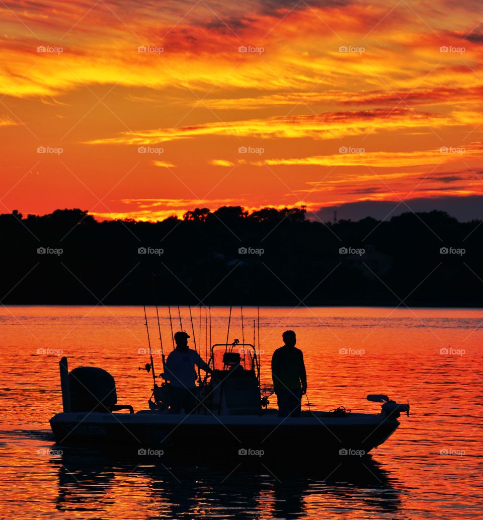 Fishermen return to the dock after a day fishing on the bay! Alluring Sunsets! Like the meeting of two worlds - the known and the unknown. The sun is like a great big romantic, inspirational fire in the sky. Brilliant streaks of yellow, orange, gold, blue, pink and red overcome the blue and purple of the sky. The sky resembled a prism; all the colors blended perfectly together. It's as if the colors and intensity of the light is just enough to calm you. The brilliant orb of amber and tangerine sunk lower and lower in the sky until it dipped down into the horizon. My work is done for today. I'm not sure what tomorrow will bring, but I'll be prepared for it!