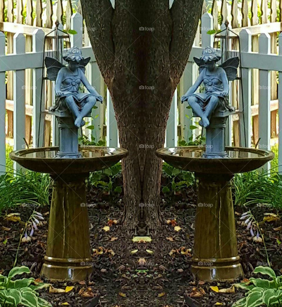 Mirror-image Twin Angels. Mirror-image of a corner landscaped area.