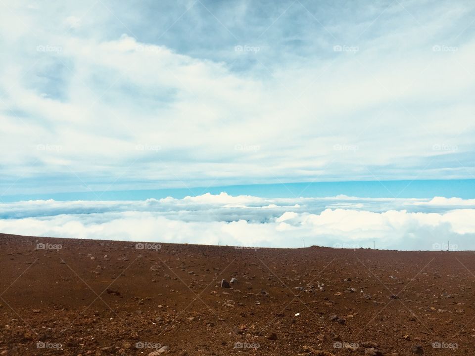 Above clouds on the top of the volcano 