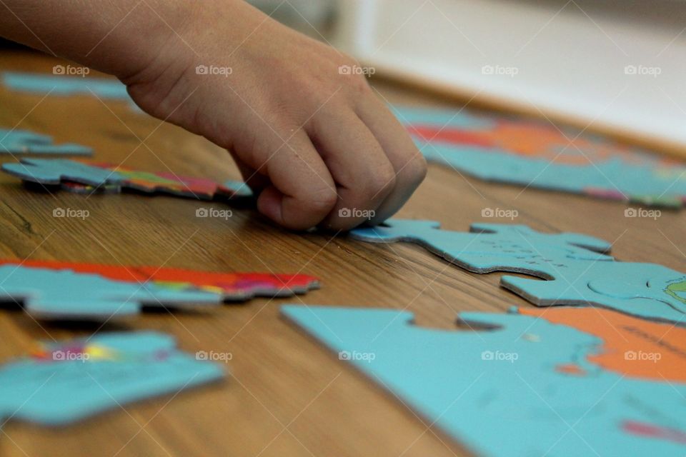 Boy playing with puzzle