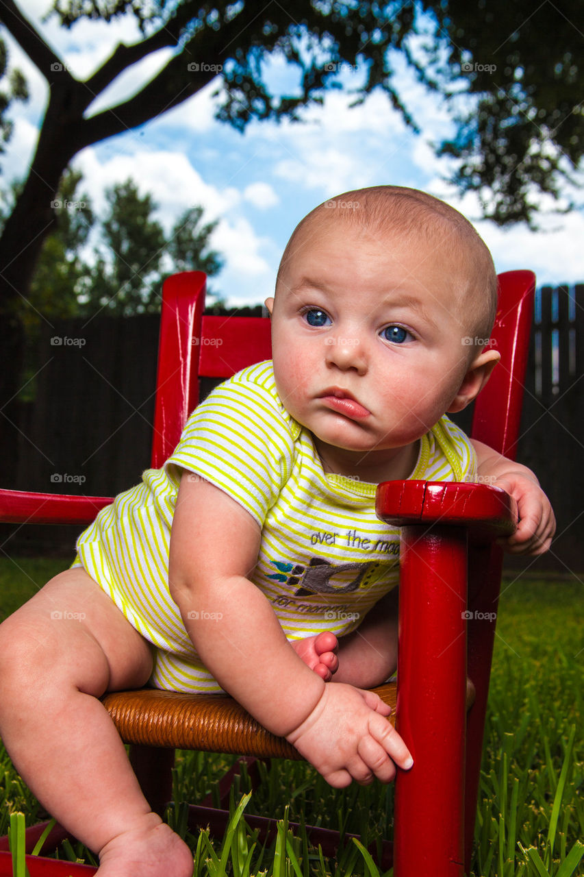 Infant sitting in chair