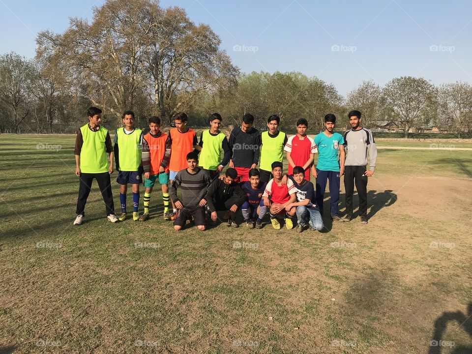 My soccer team preparing for practice session at sports stadium Tik bagh kashmir