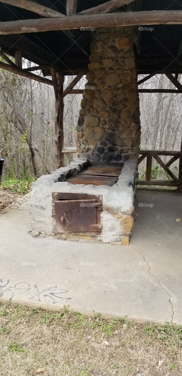 Old stove/grill made of stone.