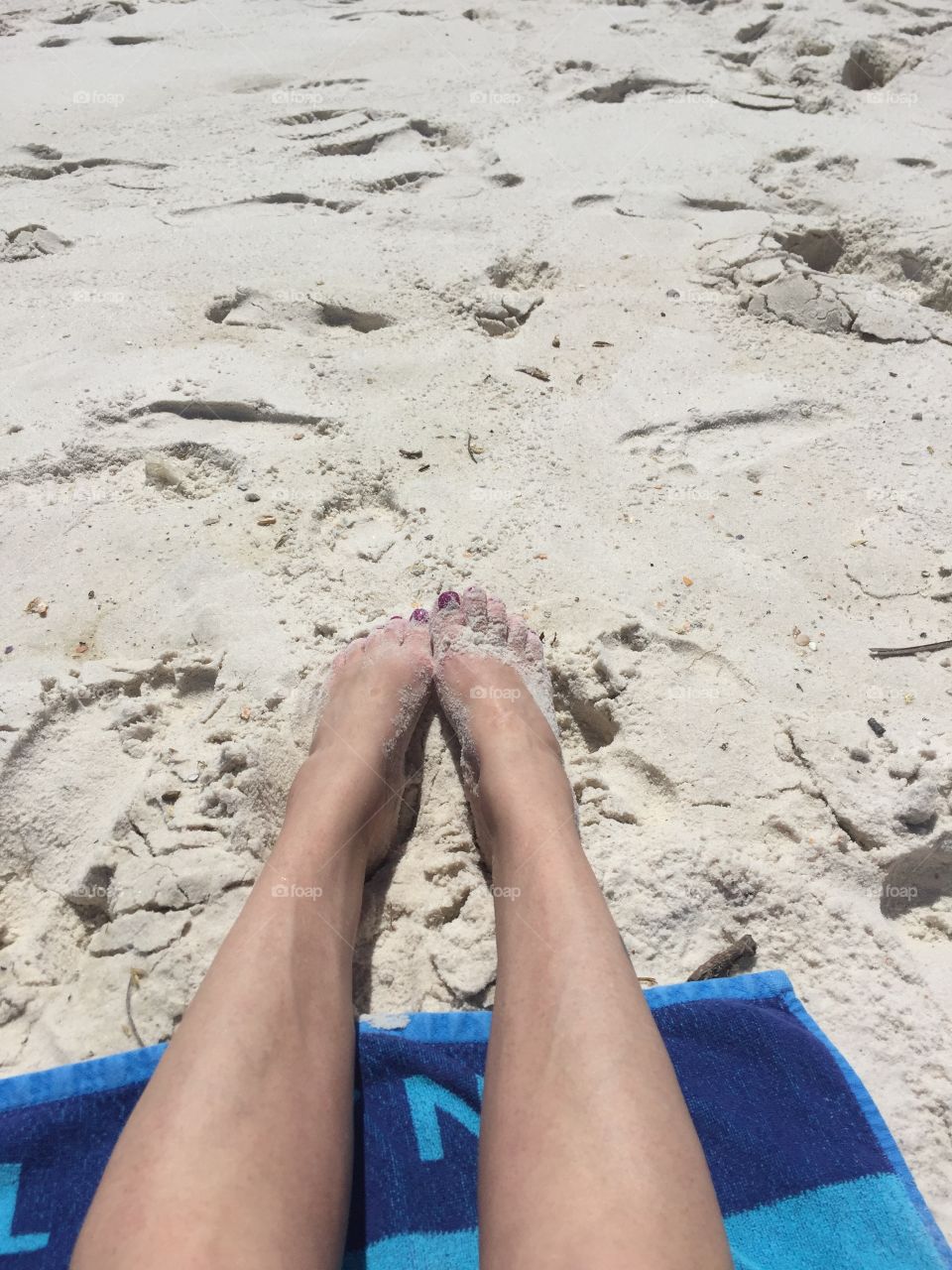 Wife has toes in the sand