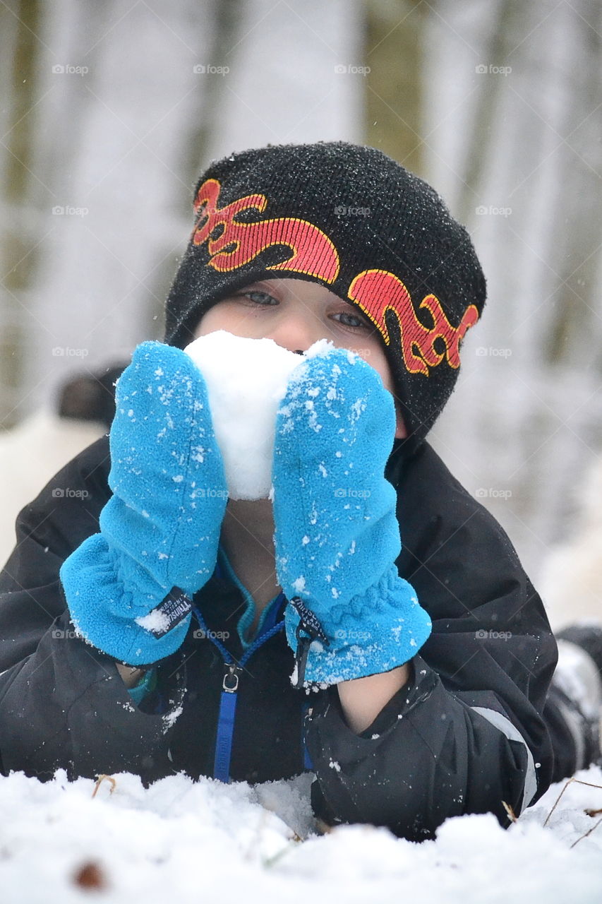 Boy making a snowball