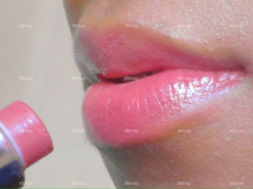 Closeup of lipstick and lips 