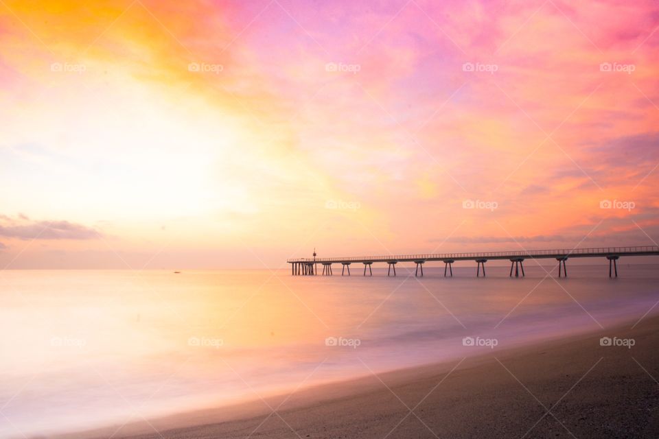 Pier over sea during dusk