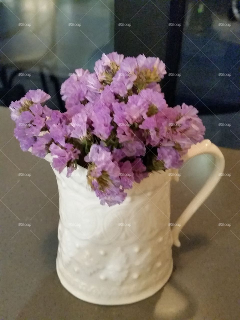 Wild flowers arranged in a milk pitcher