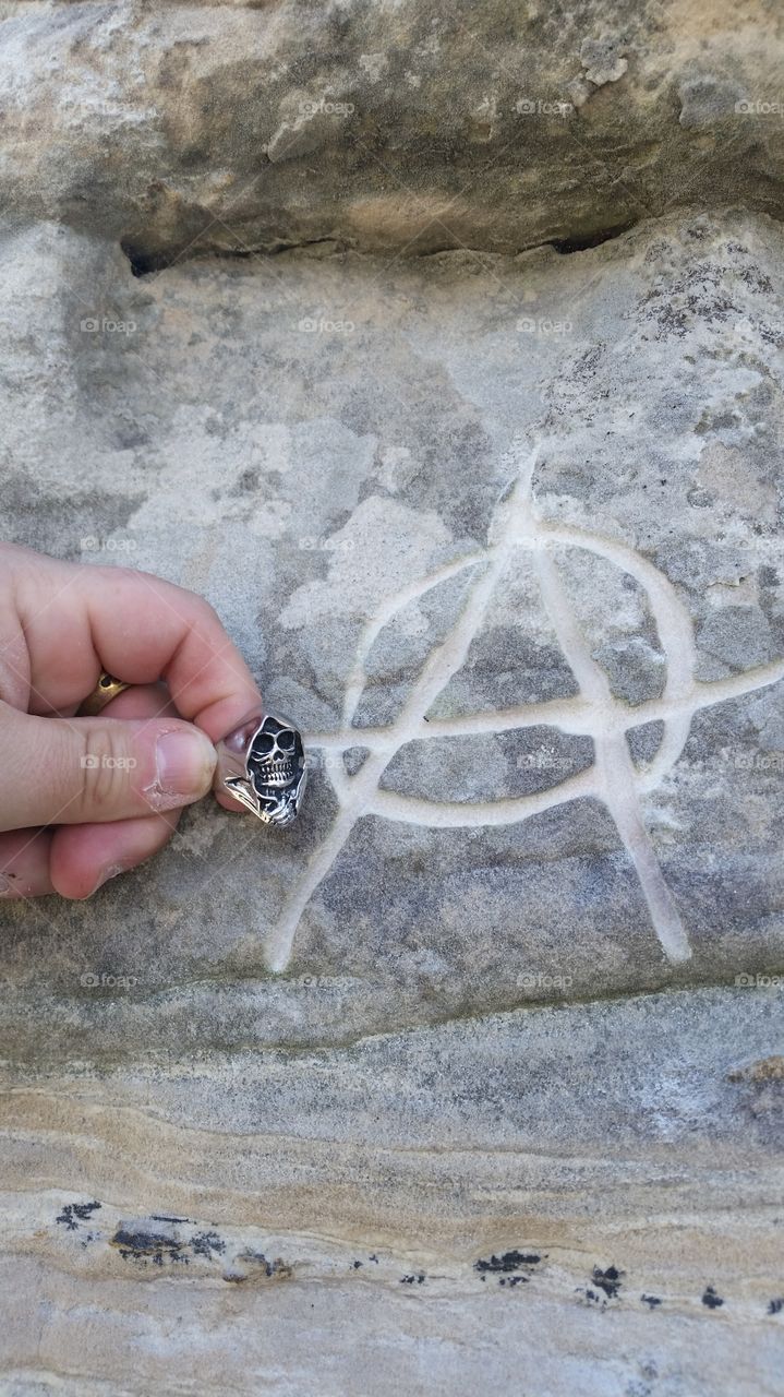 anarchy. carving in a rock