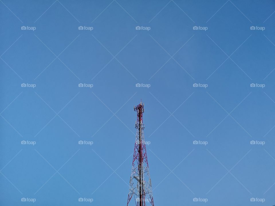 Telephone pole with blue sky.