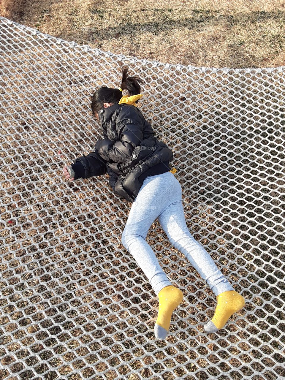 she got a new bed outside. she must jump on it but i dont know why she keep laying on it and it makes her happy.