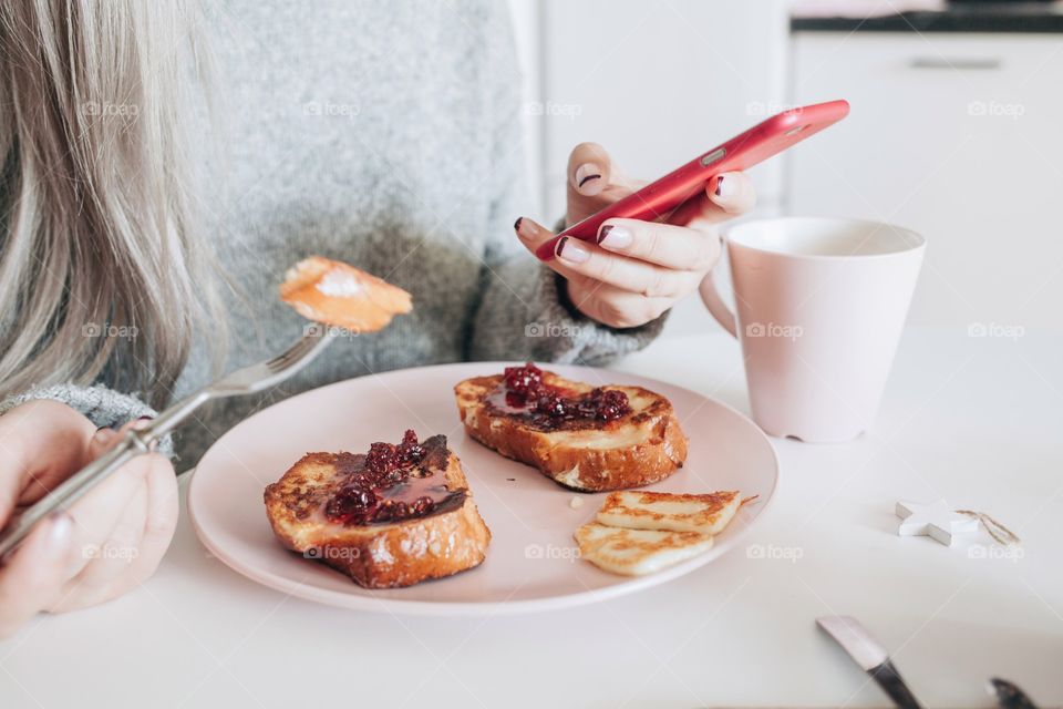 Woman eating breakfast