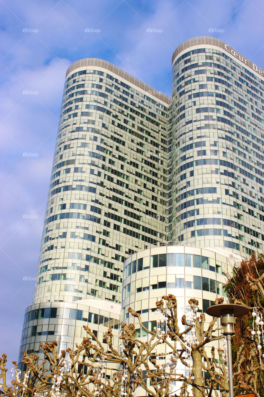 Under a big skyscraper full of windows 