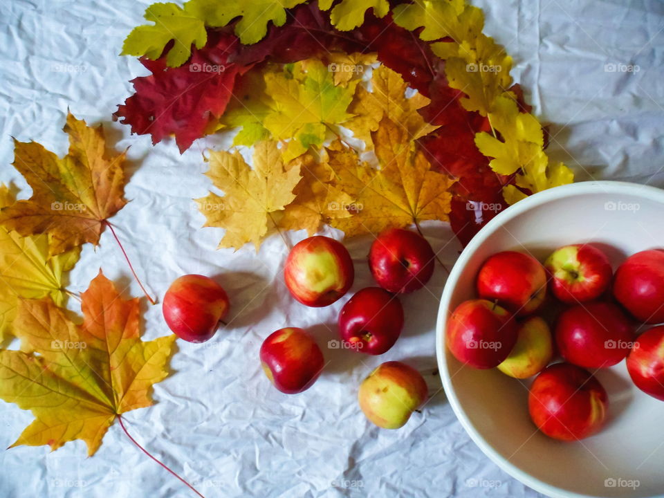 colorful autumn leaves and apples