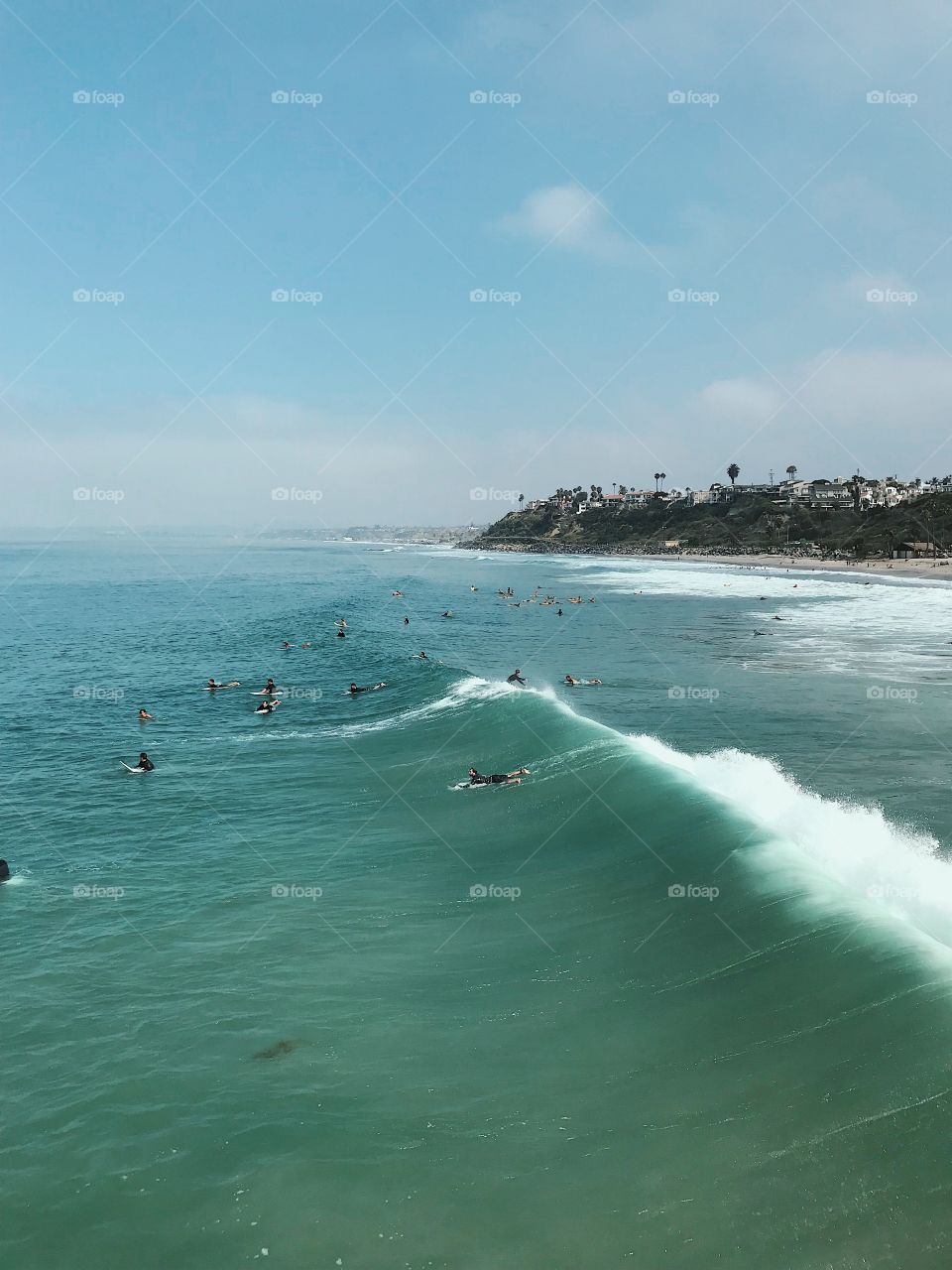 Beautiful afternoon at the beach watching the surfers catch some sweet waves on the west coast. 