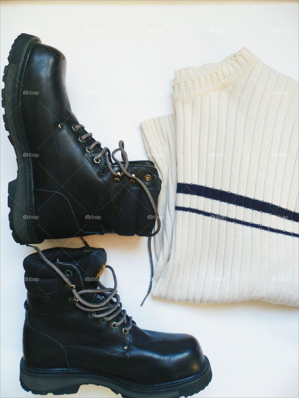 black men's shoes, and white sweater on a white background