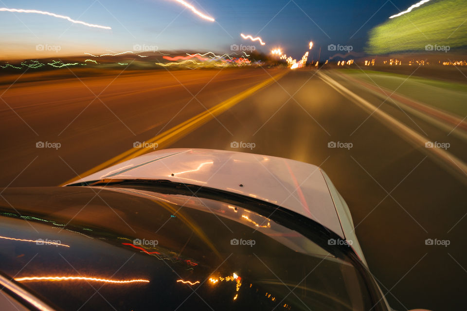 Whit Vera driving with blurry road except the car