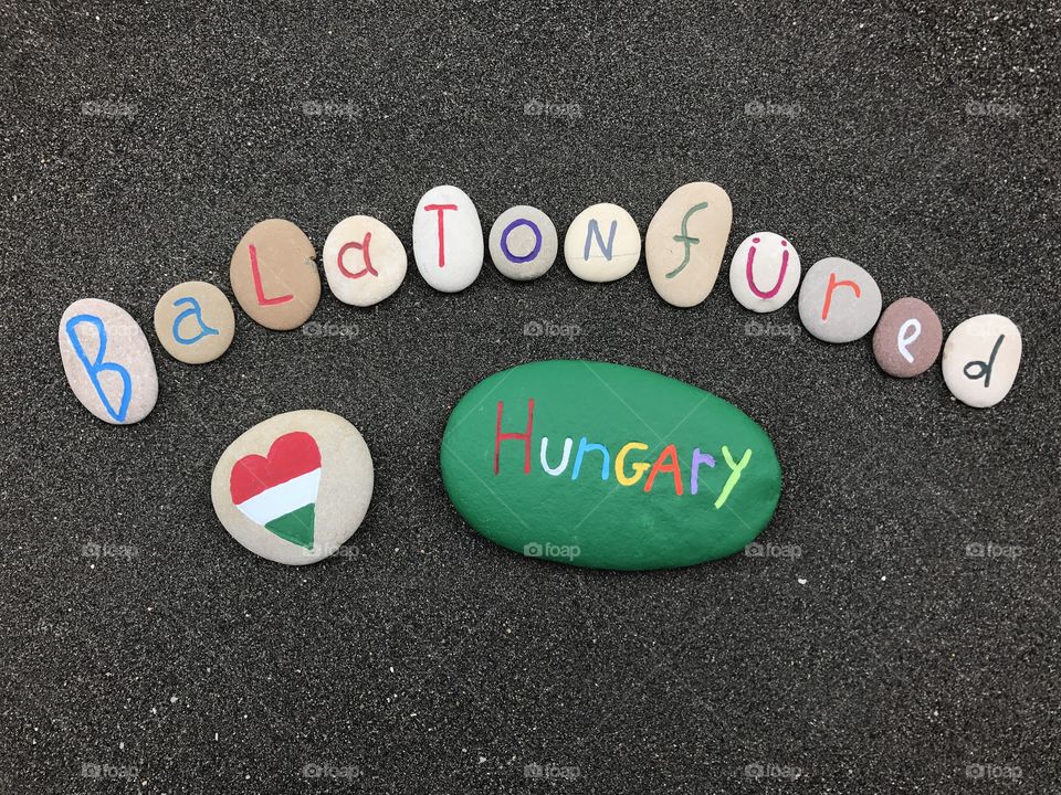 Lake of Balatonfüred, Hungary, souvenir with artistic stones over black volcanic sand 