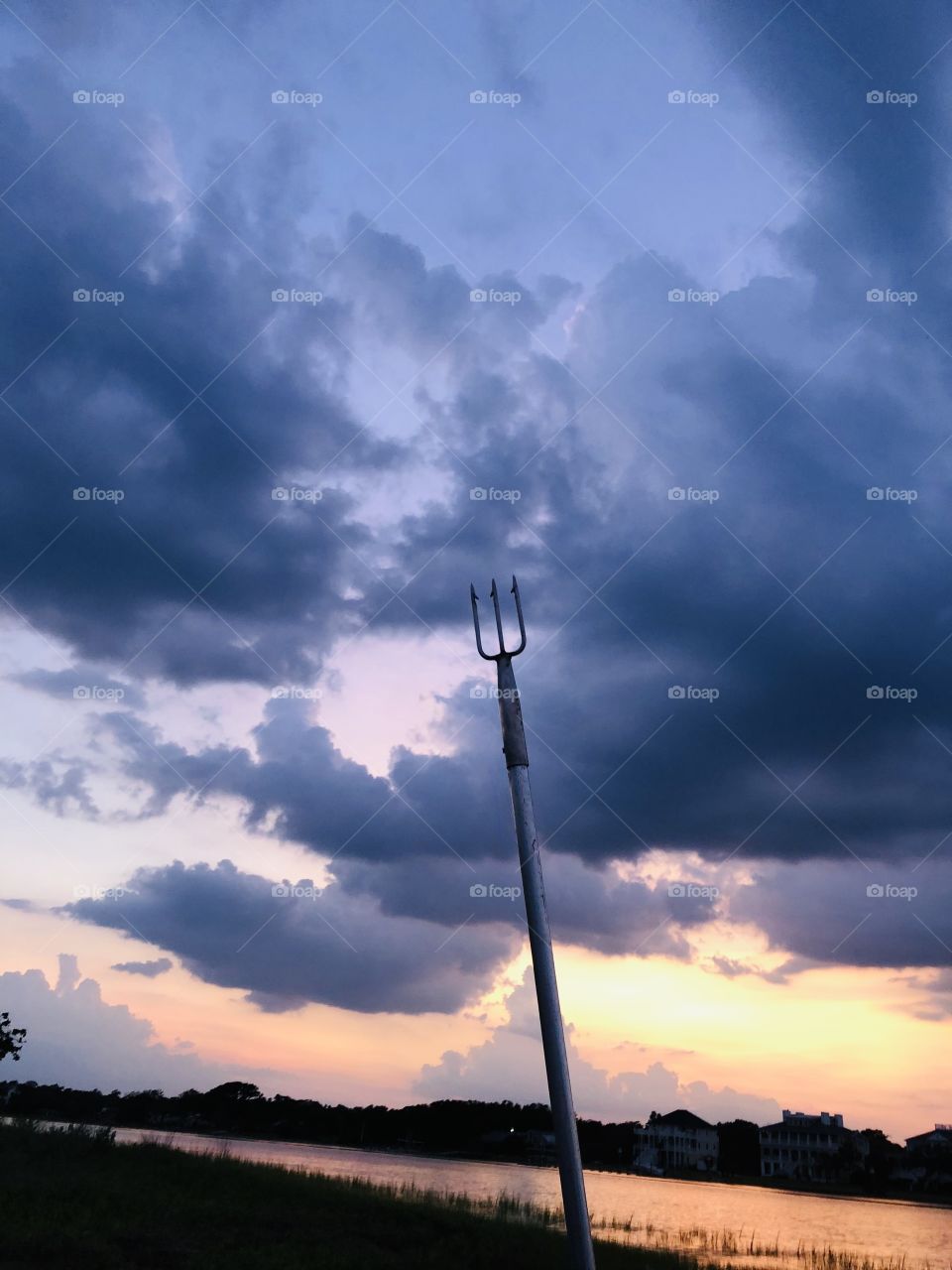 Coastal NC flounder gigging night with beautiful sunset and clouds