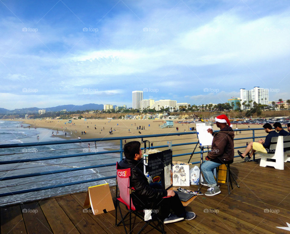 Relaxing by the pier, Santa Monica, December, artist