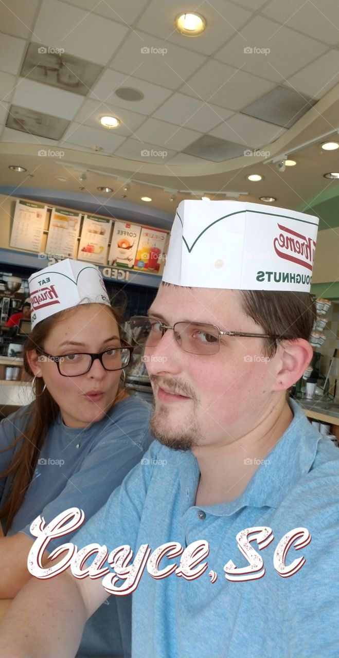 goofing around at Krispy Kreme donuts. delicious!