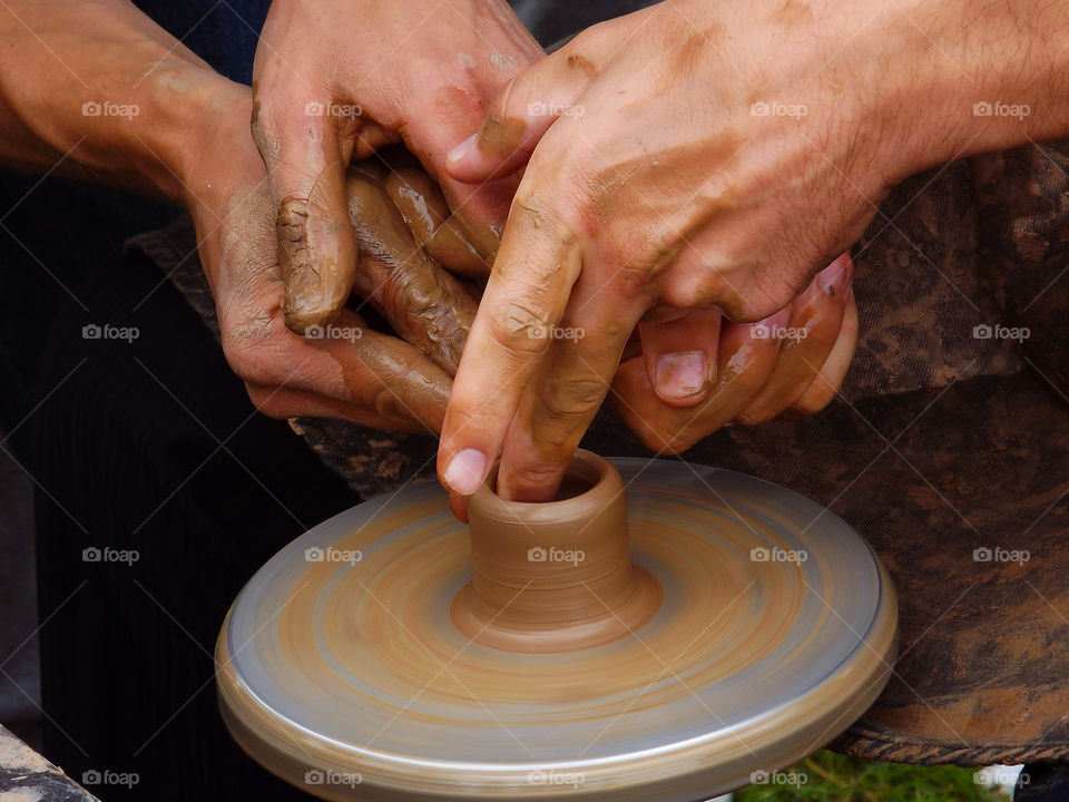 Close-up of potter making pottery