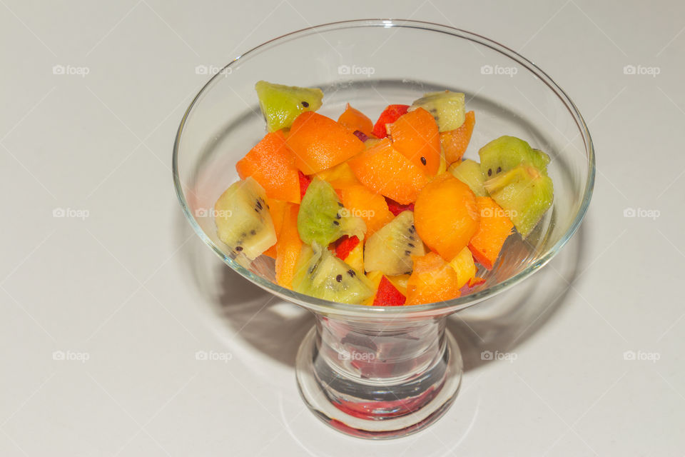 Fruit salad of apricot, blue plum, kiwi and peach