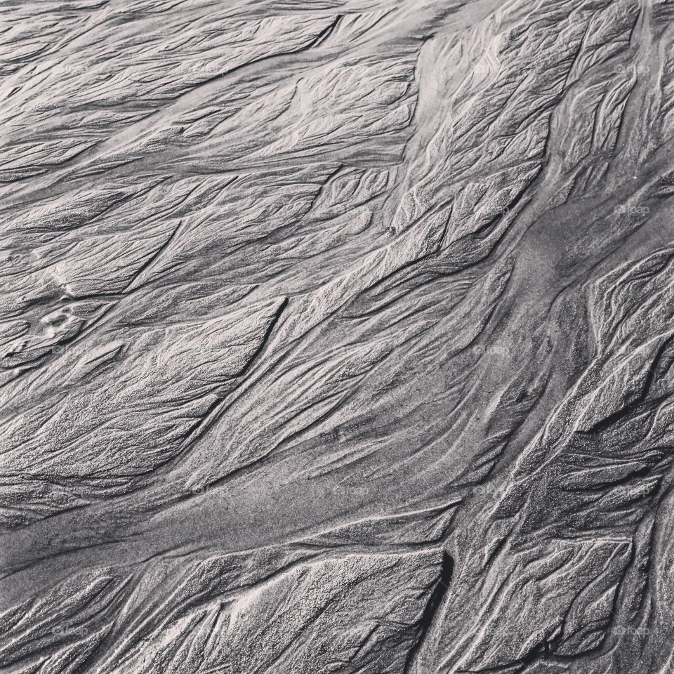 Black and white sand ripples