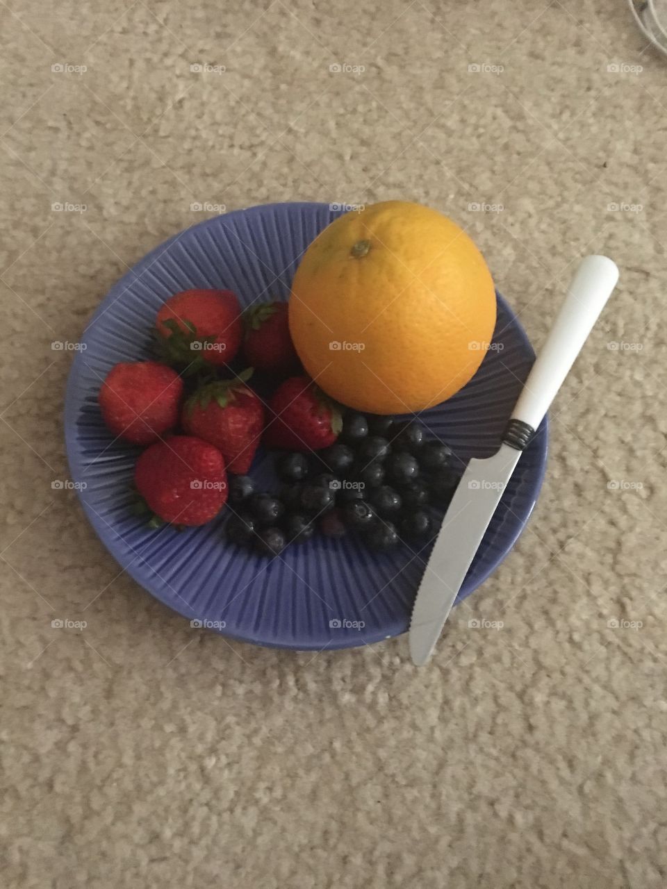Strawberries, blueberries, and an orange - a complete breakfast if I do say so myself.