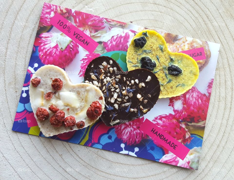 colourful raw vegan chocolate hearts handmade by Happy Herbi in the Netherlands