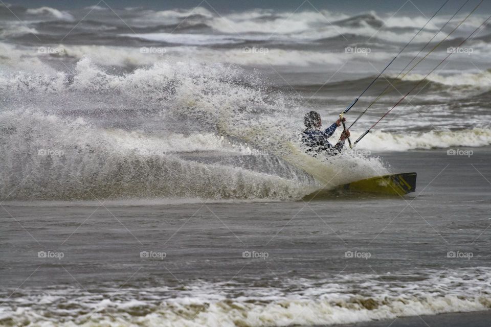 Kite surfing on a stormy day in the Dutch Northsea