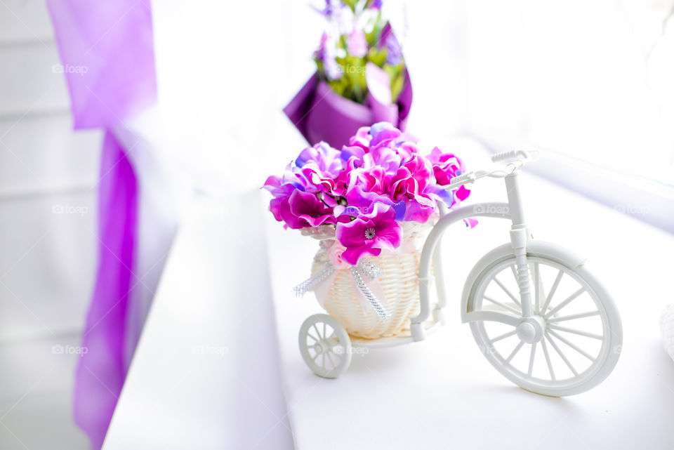 decorative white bicycle with purple flowers