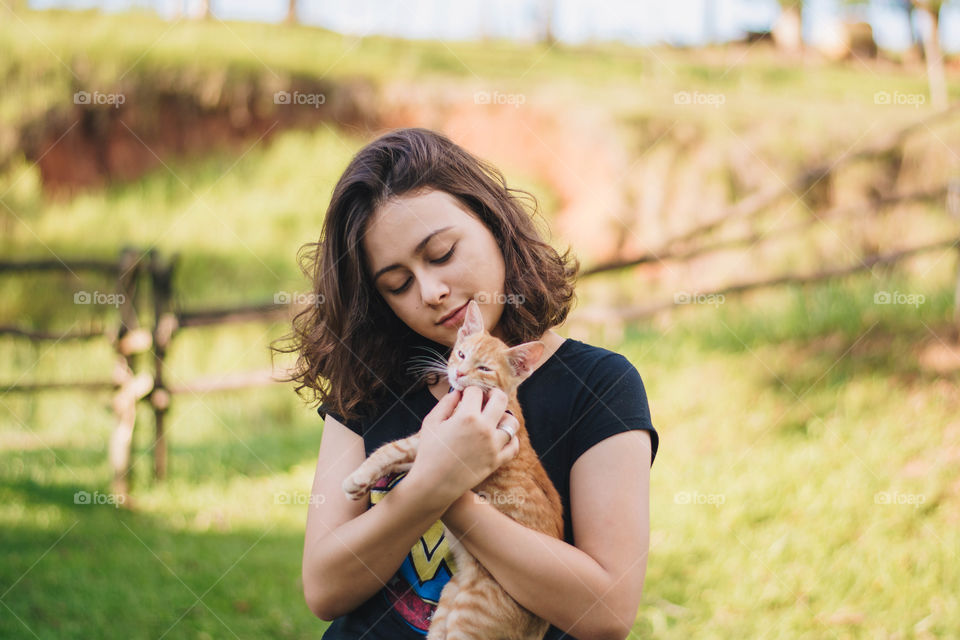 Girl holding a kitten