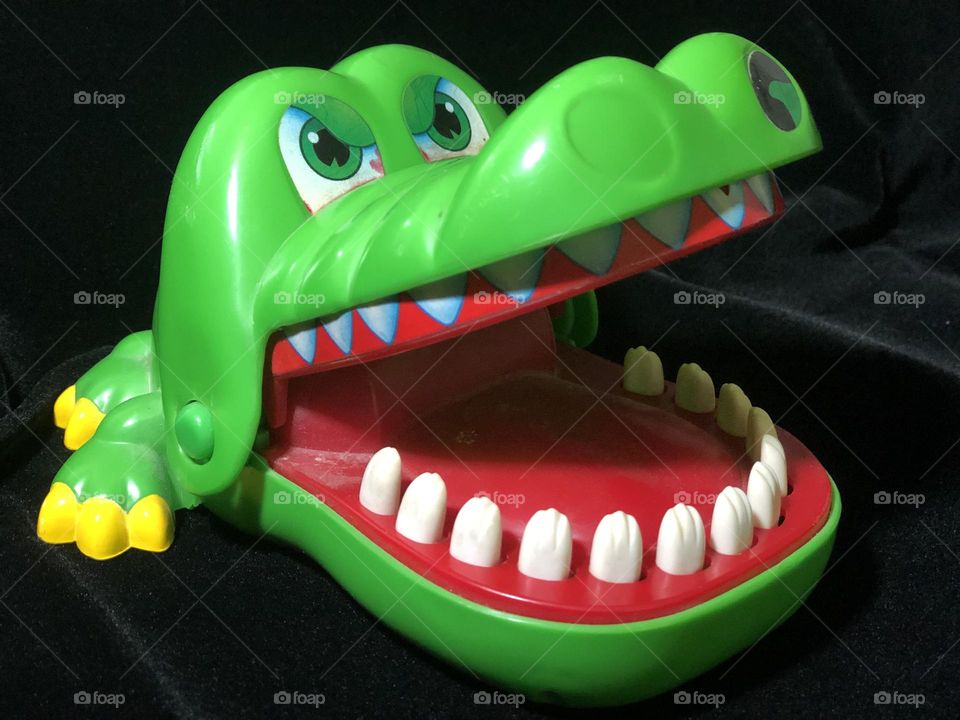 Triangle teeth and claws on alligator children toy