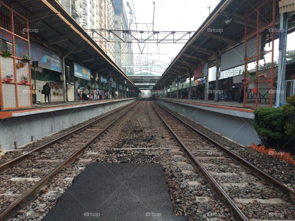 double train tracks at pondok cina station in afternoon