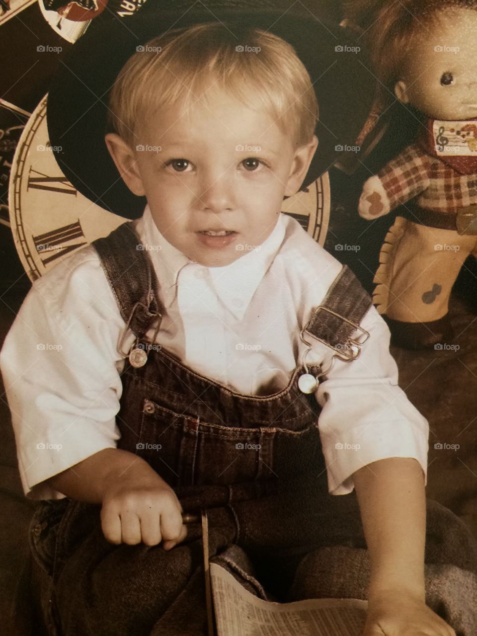 Portrait of cute little boy sitting