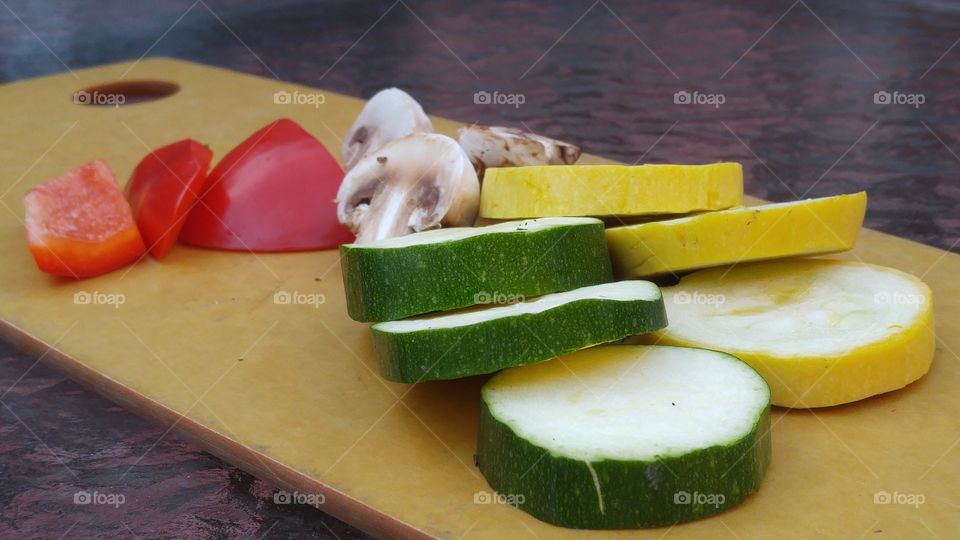 green cucumber slices yellow squash slices red bell pepper slices and mushrooms