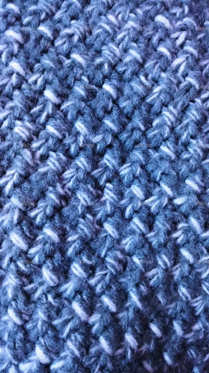 close up of a blue woven blanket