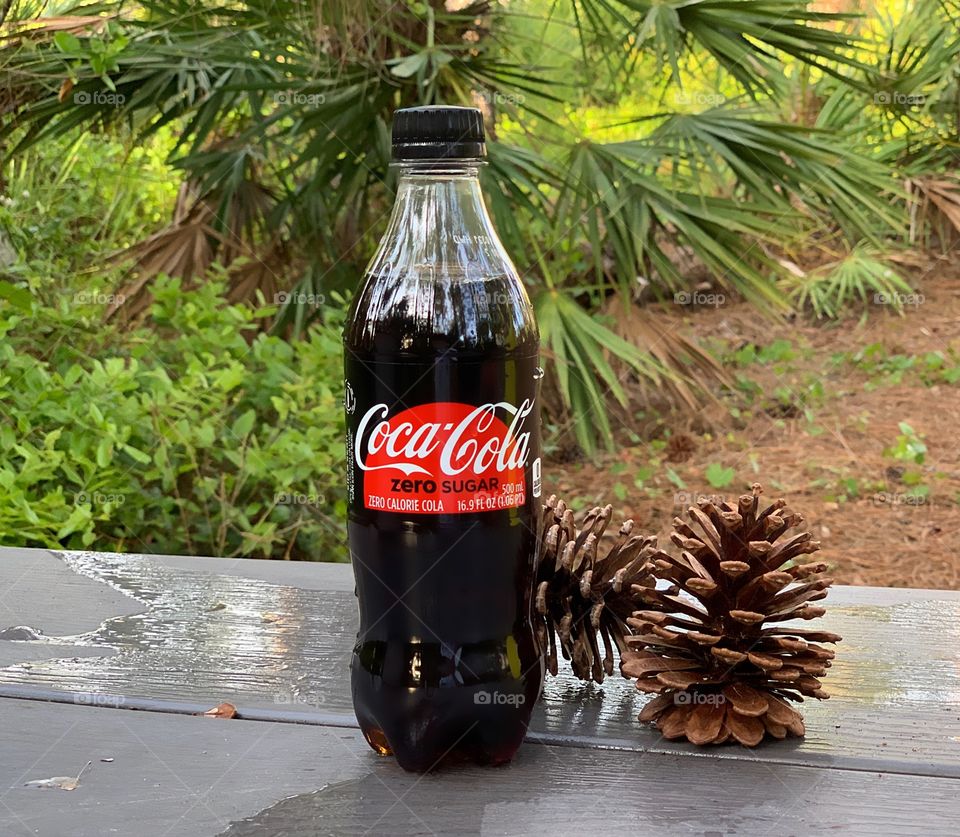 Coca Cola refreshing and delicious while enjoying nature.
